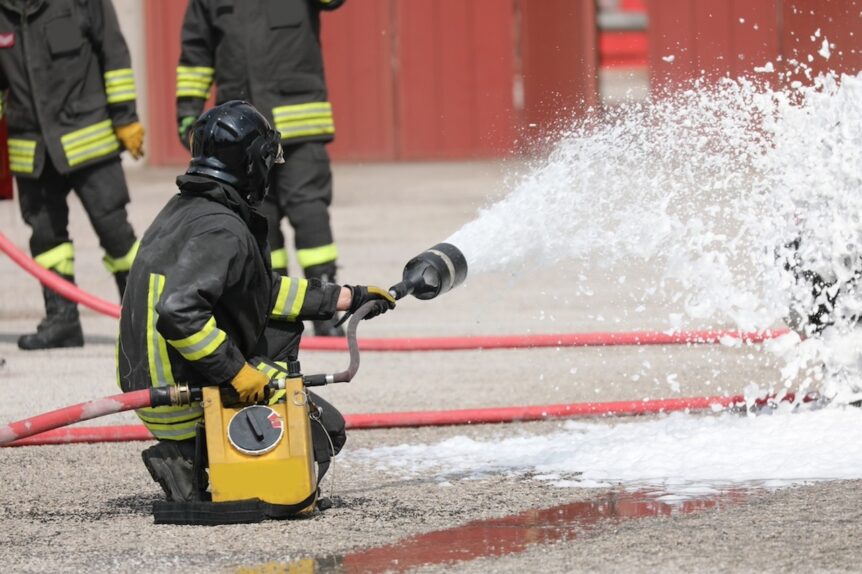 firefighters with the special flame retardant foam extinguish a fire