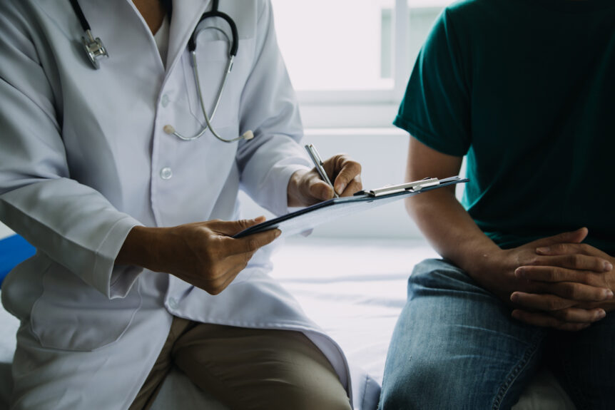 patient care provider walks through cancer screening with patient
