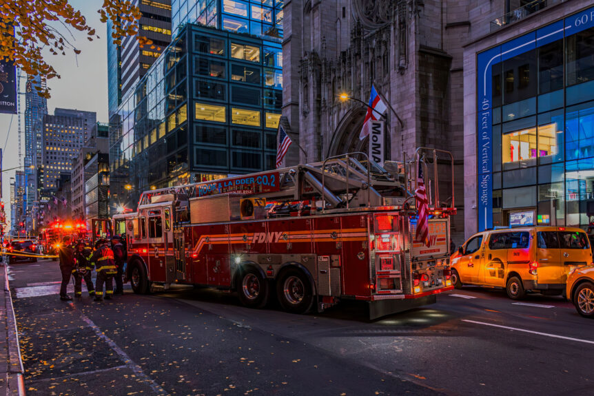 A fire ladder sits in the middle of an urban city street